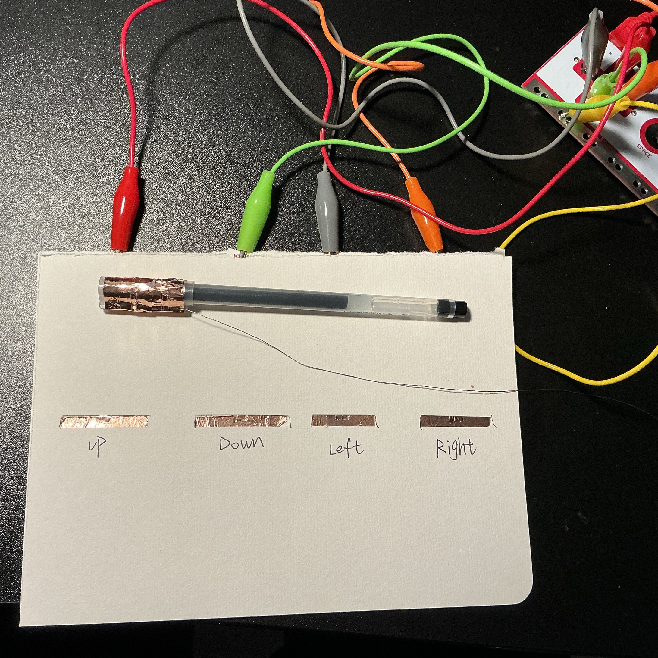 This is my model of the command. I taped copper tape to the cap of the pen so I could use the pen to interact.