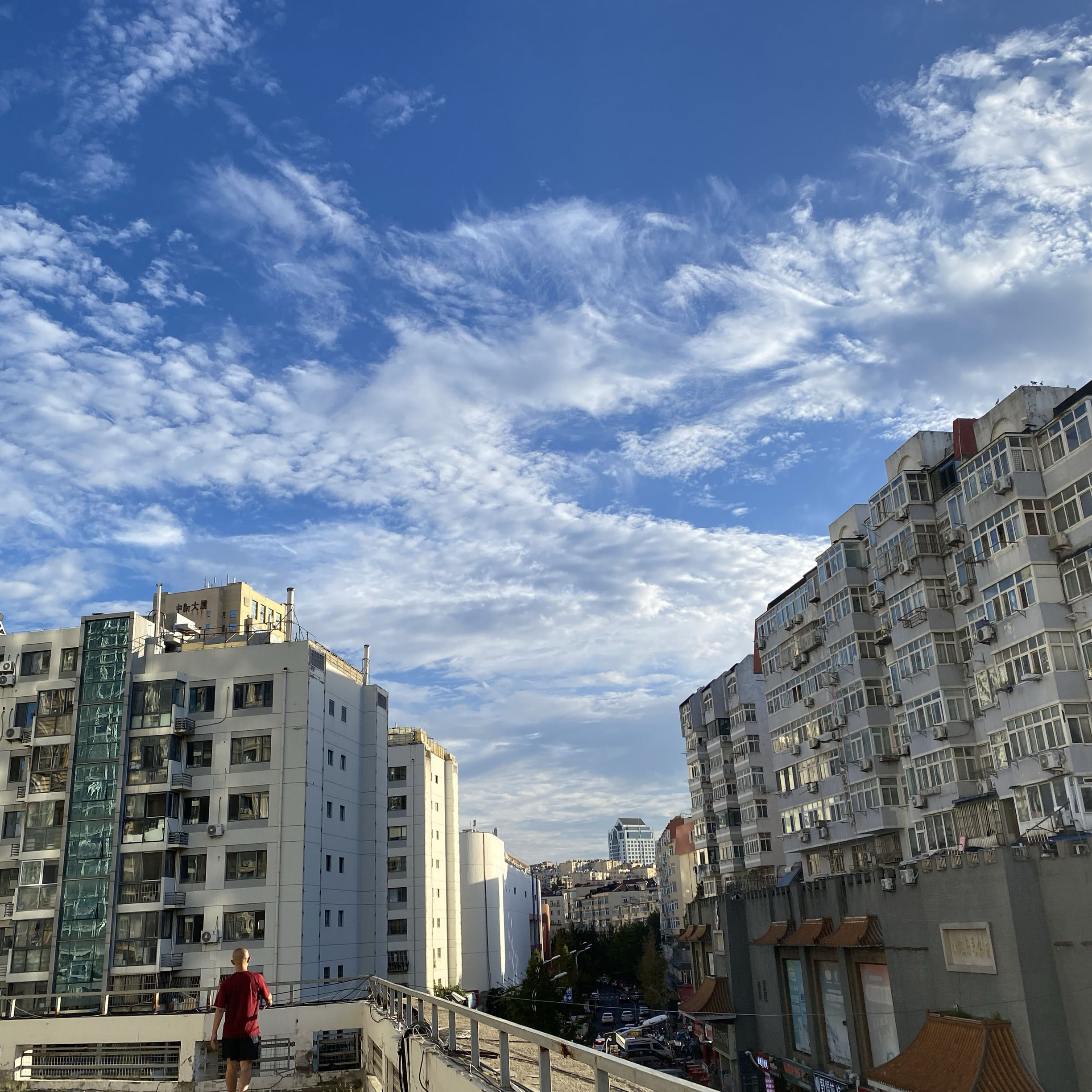 Beautiful sky and tall buildings on the platform.