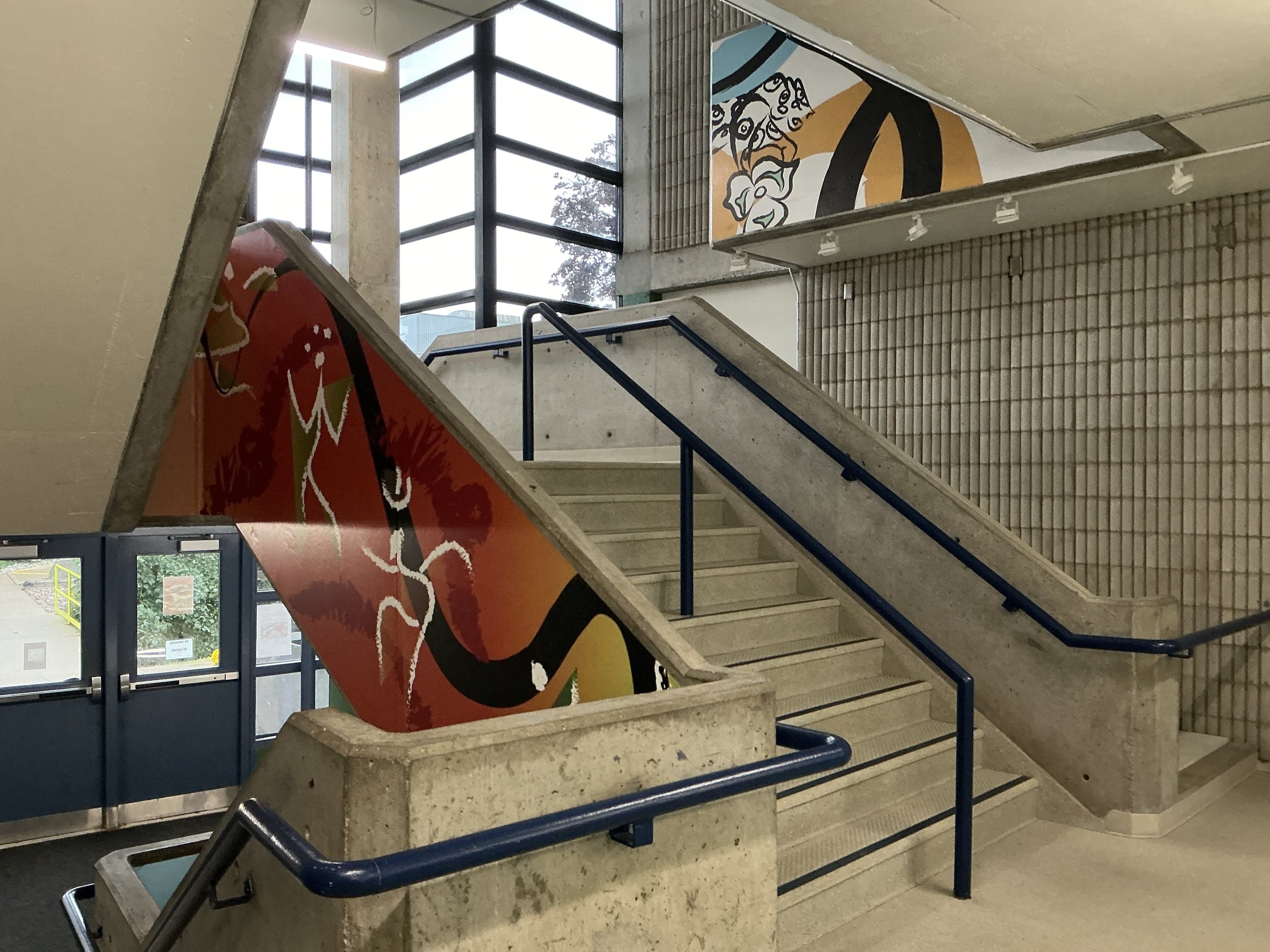<ul><li>Painting on the wall and colorful background</li><li> 
            This is the b wing stairwell. It connects the first floor to the roof. </li><li>
B wing</li><li>
Interior</li><li>
transitional space</li><li>
All people need to go up and down</li>
          </ul> 